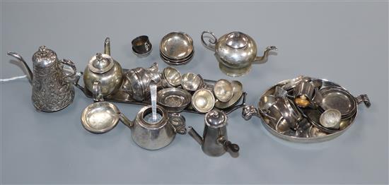 A collection of English and Dutch miniature silver and white metal tableware,
